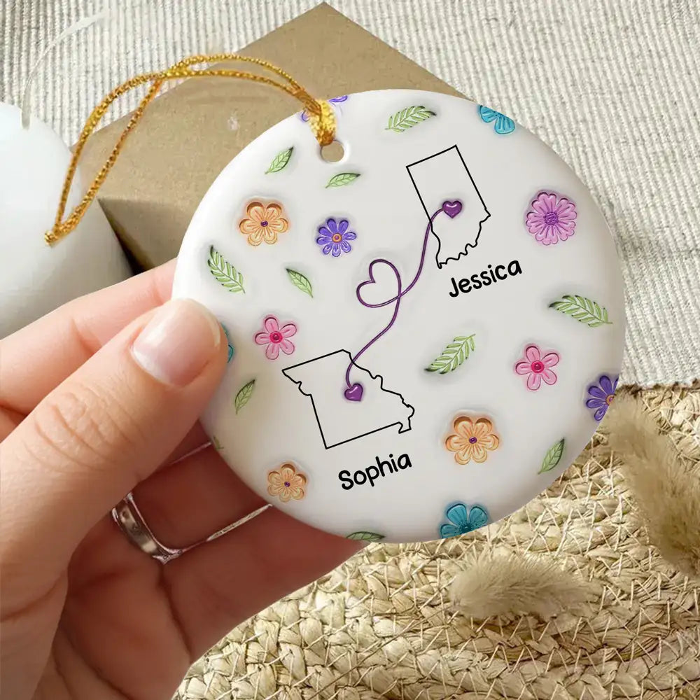 Sisters Across States Round Ceramic Ornament with Heart Path & Floral Accents